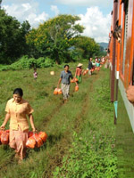 Carrot sellers at a station, Myanmar