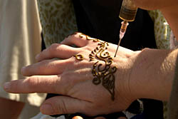 Henna being applied to hand - Marrakech, Morocco