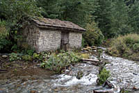 Stone building by river
