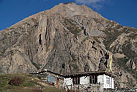 House dwarfed by mountians