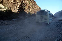 Bus and dust on road